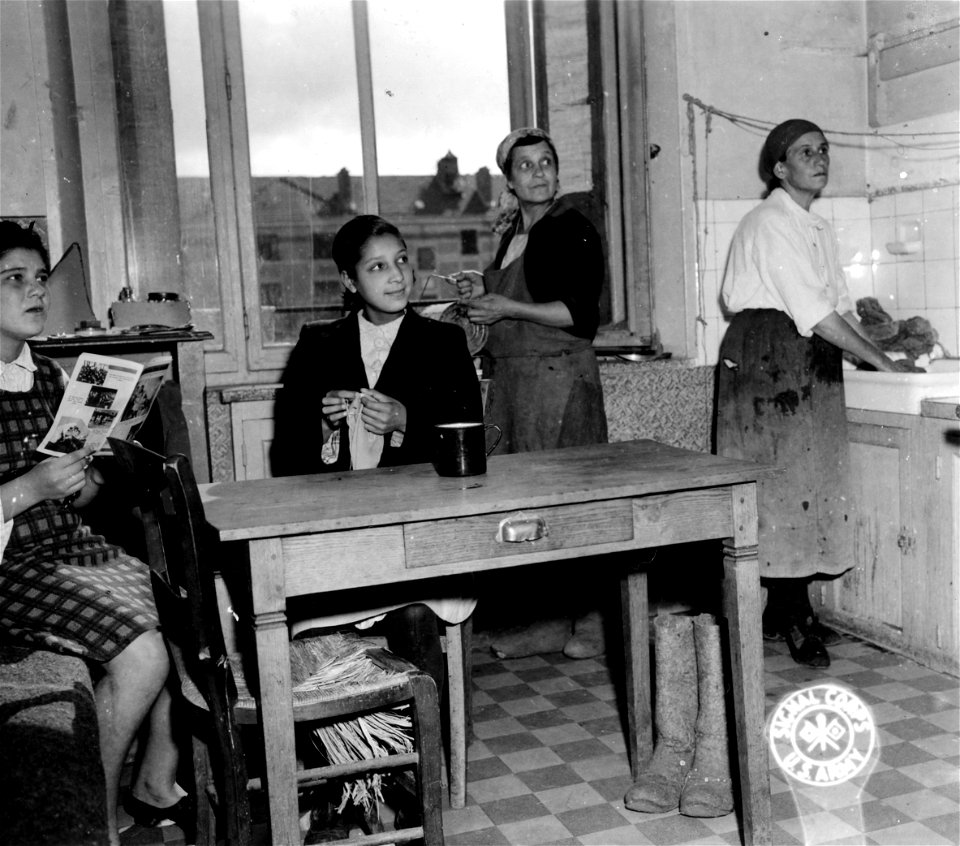 SC 404992 - Scene in a kitchen of a typical Russian family. These people are among the many who have been recently liberated by rapid Allied advances at the newly established Displaced Persons Center at Briey, France.