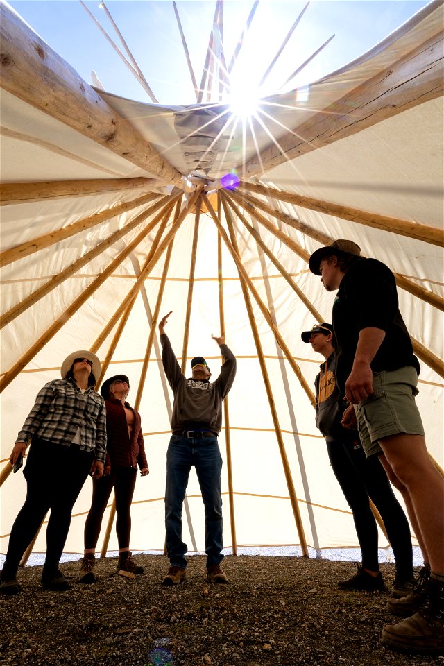 Yellowstone Tribal Heritage Center opening day 2023:artist Mike Redman explains the teepee structure to visitors