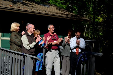 Following the ribbon cutting, conservation partners celebrate the opening of the Bob Hines Refuge Ranger Station.