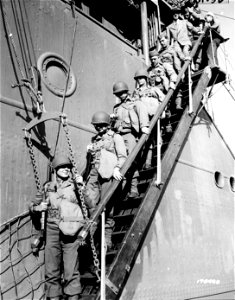 SC 170430 - Members of a Signal Photo Detachment are shown debarking from a troopship, somewhere in Australia. 23 July, 1942.
