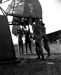 SC 195700 - Yanks of an airborne unit close the cargo loading hatch of a glider preparatory to the takeoff from England for the invasion of Holland. 17 September, 1944. photo