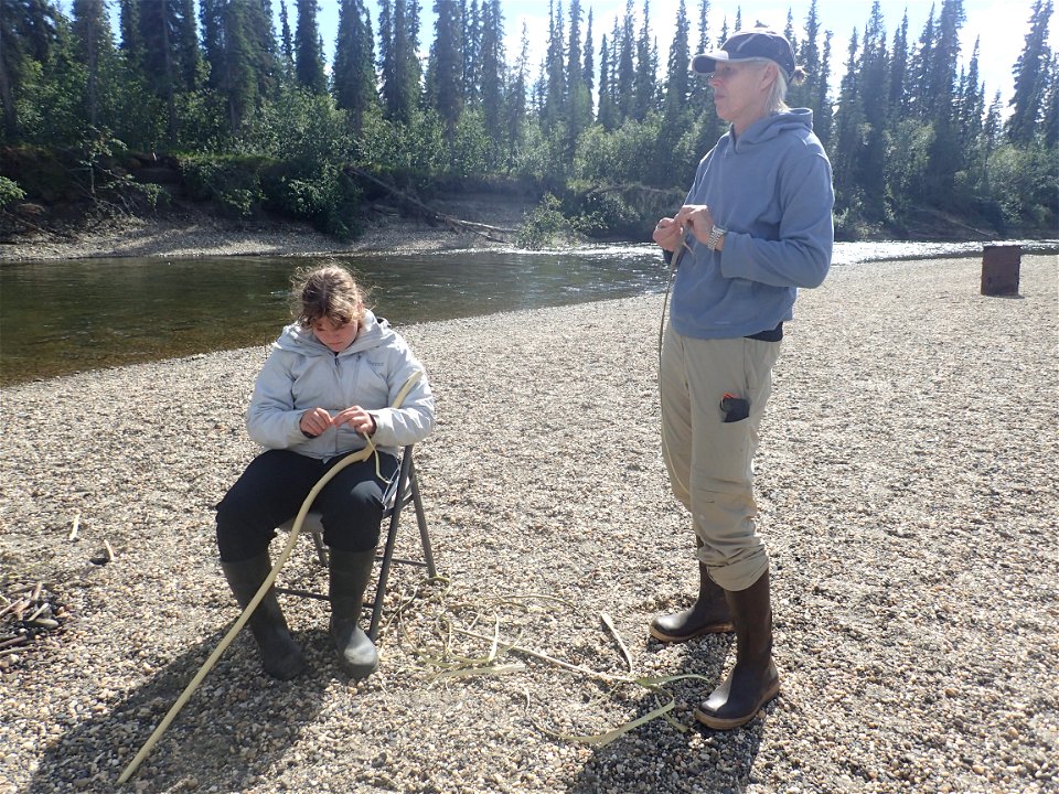 R7 Kanuti NWR Volunteer Sheryl makes walking sticks with youth at science camp photo