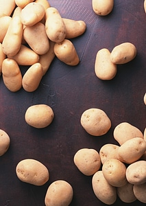 fresh organic potatoes on table