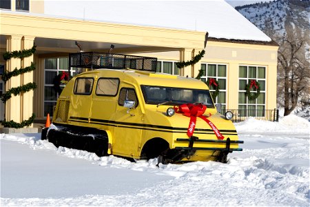 Xanterra Bombardier snowcoach decorated for the holidays in front of the Mammoth Hot Springs Hotel (1) photo