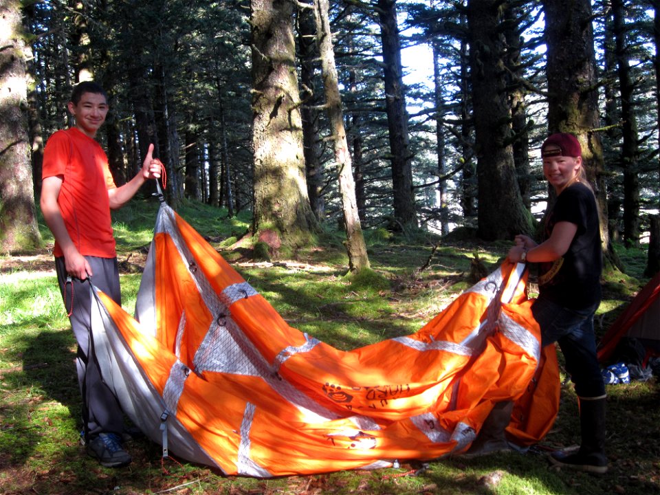 The boys set up their tent.
