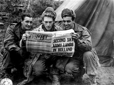 L-R: Pvt. John V. Travis, 1901 Clarendon St., Chicago, Ill.; Cpl. Howard A. Kersting, 19 S. Washington St., Naperville, Ill., and S/Sgt. Elmer R. Deichstetter, of Chicago...