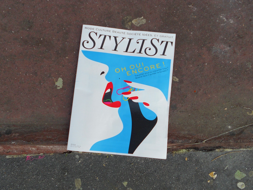 Stylist Mag Carelessly Laying on a Pavement