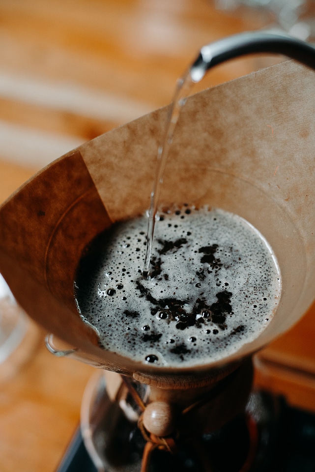 Close-up view of bartender preparing coffee