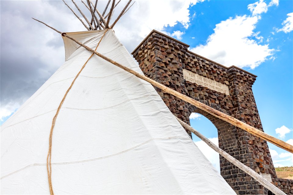 North Entrance teepee installation event: teepee and Roosevelt Arch inscription
