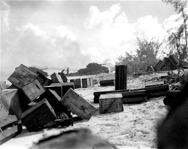 American troops, assaulting Saipan, dig in on the beaches of the island. 15 June, 1944.