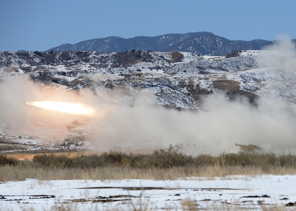Soldiers fire a rocket