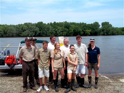 USFWS Fisheries staff take time out to smile for the camera with the Aqua Kids on the banks of the Illinois River. USFWS Photo.