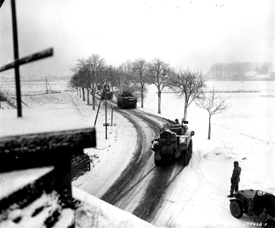 SC 199028-S - Sherman tanks move along slippery roads during heavy snowstorm on way to new positions in France. 20 January, 1945.