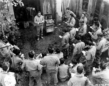SC 195508-S - Japanese-American infantrymen attend church services outside their billet in France. 24 October, 1944.