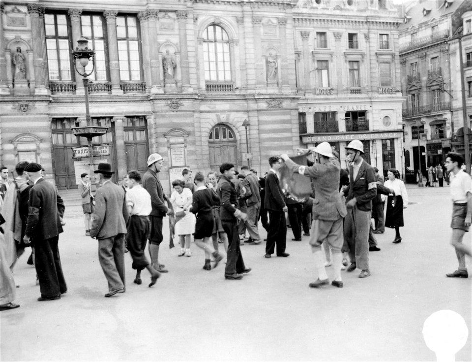 SC 337264 - Frenchmen of the town of Angers celebrate their liberation by burning the swastika that long flew over their town in the town Awuare.