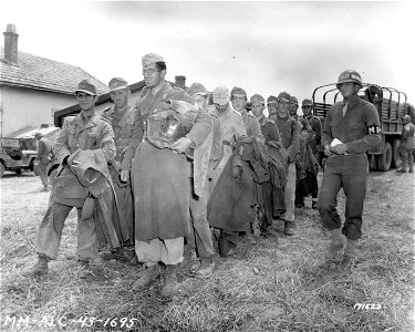 SC 171623 - An American M.P. with a portion of German prisoners that were taken after the Allied Armies took the whole of North Africa.