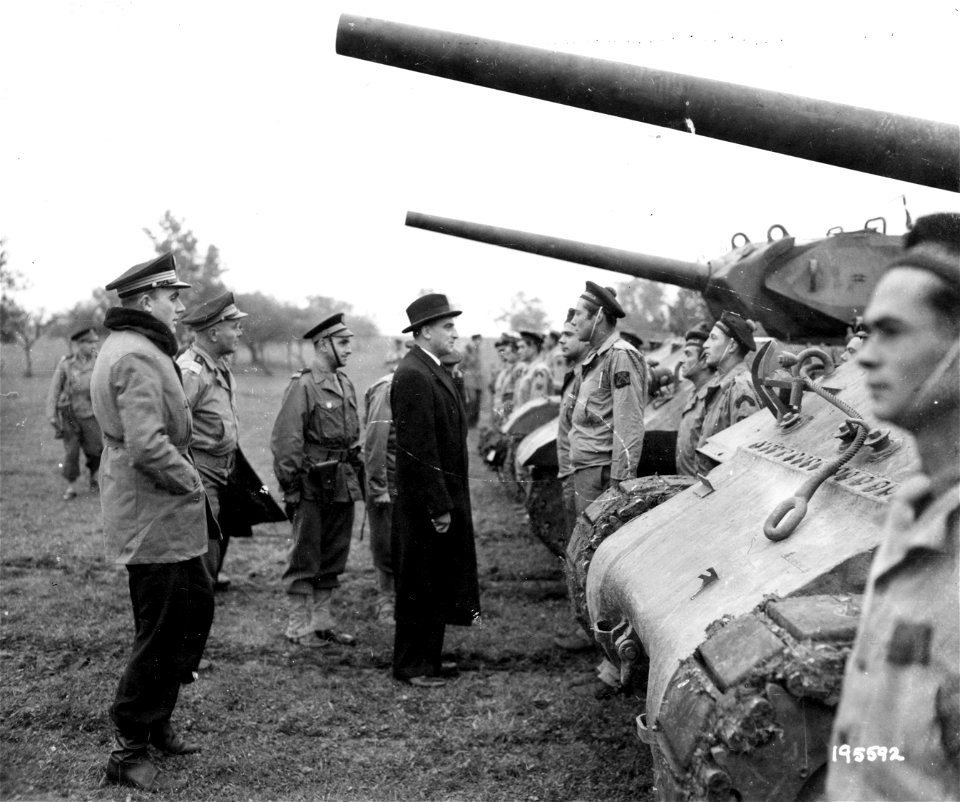 SC 195592 - French Naval Minister Jacquinot, accompanied by ranking French naval officers, inspects a tank destroyer unit of the 2nd Free French Armored Division, manned by French marines, somewhere in France. 9 October, 1944.