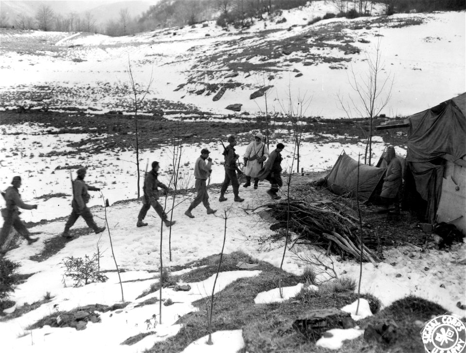 SC 374810 - Patrol arriving at an outpost located in former ski training locale for the Italian Army. Pianaccio area, Italy. 24 December, 1944.