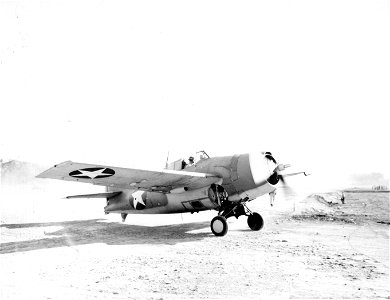 Home after a raid: A Marine Grunman fighter plane comes home to roost at the Guadalcanal, Solomon Islands airfield after feeding the Japs hot bullets.