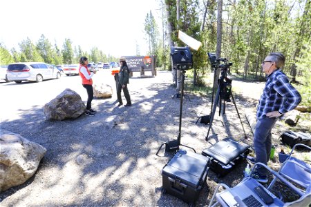 Yellowstone south loop reopens, West Entrance June 22, 2022: news media at the entrance sign photo