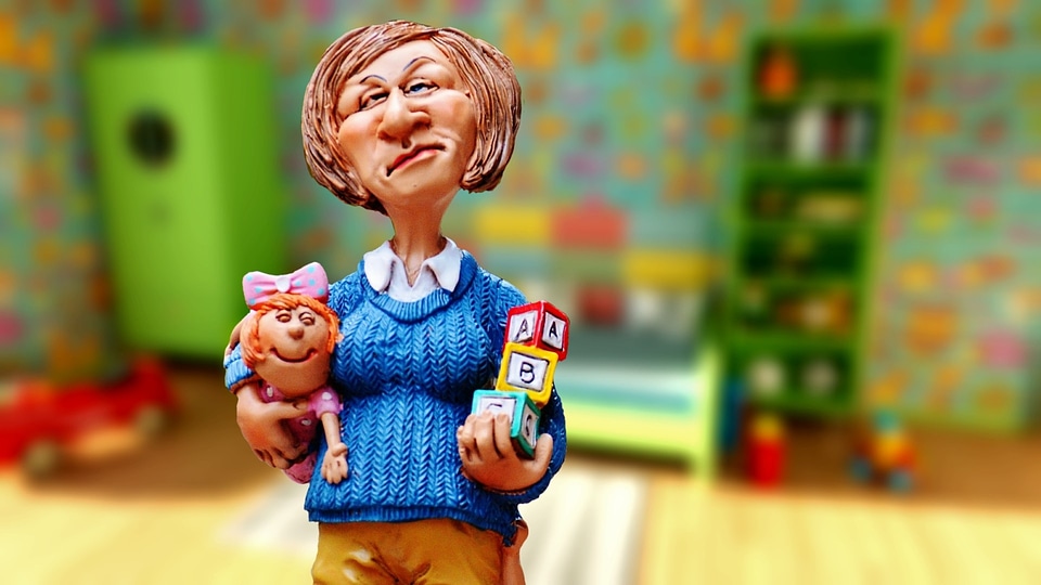 toy woman doll on the wooden floor against the room