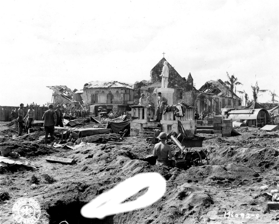 SC 196093-S - Invasion troops dig antiaircraft machine gun posts in the ruins of Dulag, Leyte Island, P.I. 22 October, 1944.