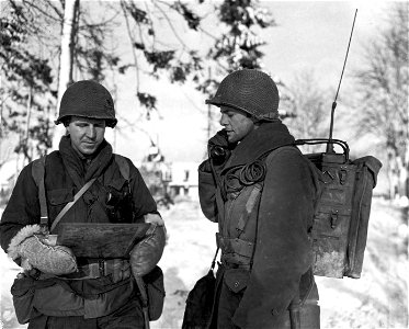 SC 337214 - Checking regimental radio communications are L to R: Lt. Milton Munch, Lovington, Ill., and Sgt. Tom Rusert, Buffalo, N.Y., members of the 357th Regiment, 90th Division.