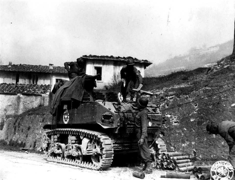 SC 329839 - Members of the 758th Light Tank Bn. (Colored) fire their 75mm howitzer in support of infantry movements on the Fifth Army front. 4 April, 1945.