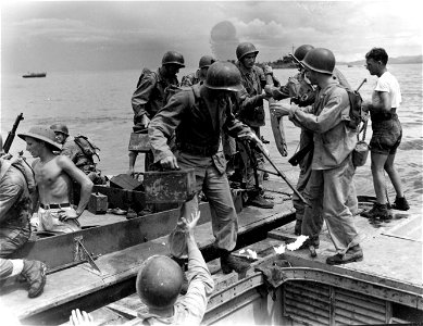 Change over from Higgins Boats to amphibious tractor is only a matter of minutes for these Marines.