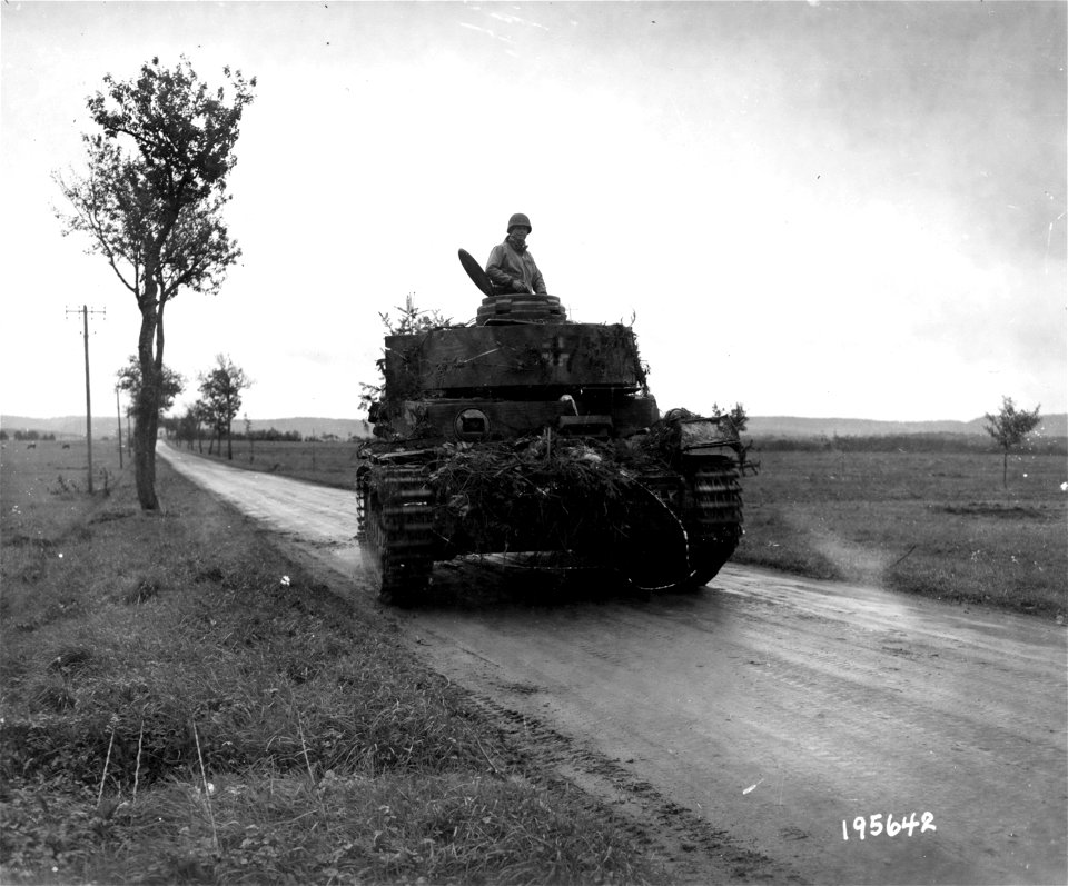 SC 195642 - This German Mark 4 Panzer tank, driven by American GIs, was captured intact during recent fighting in Grandvillers, France. 18 October, 1944.