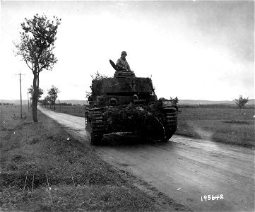 SC 195642 - This German Mark 4 Panzer tank, driven by American GIs, was captured intact during recent fighting in Grandvillers, France. 18 October, 1944.