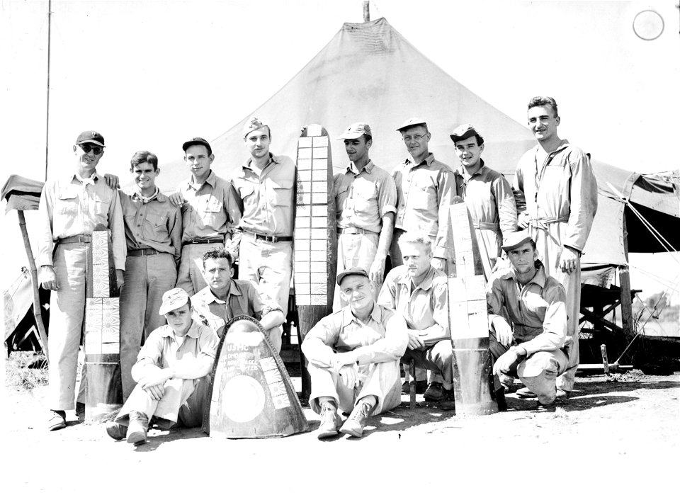 Members of a Marine fighter squadron in the South Pacific pose in front of their "ready" tent at Henderson Field.