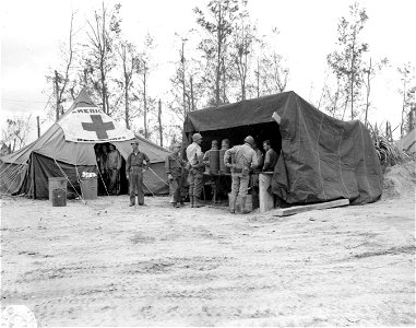 SC 329785 - Shore party and other troops on the beaches at this most newly invaded of Japanese islands were astonished to see a Red Cross tent set up serving hot coffee and donuts shortly after D-Day. Okinawa. 6 April, 1945. photo