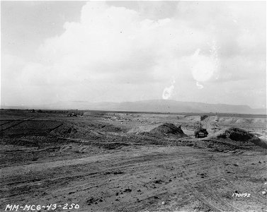 SC 170093 - Tanks lined up in a dry river, to set up as front line of defense. Kasserine Pass, Tunisia. 22 February, 1943.