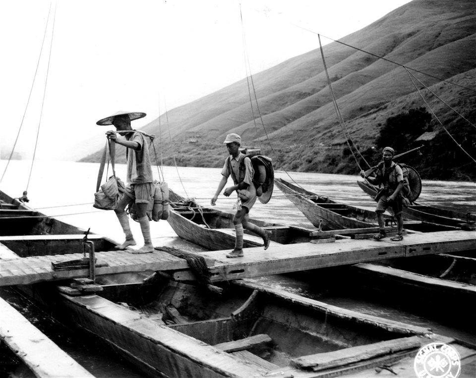 SC 221775 - Troops of the 54th Army are shown walking across the narrow 600 ft bridge at Pa-Tu on the Red River. 9 August, 1945.