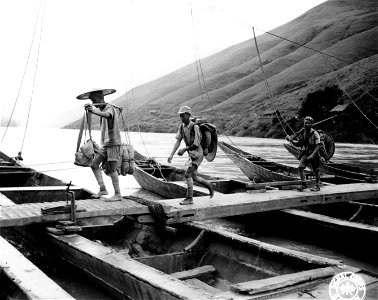 SC 221775 - Troops of the 54th Army are shown walking across the narrow 600 ft bridge at Pa-Tu on the Red River. 9 August, 1945.