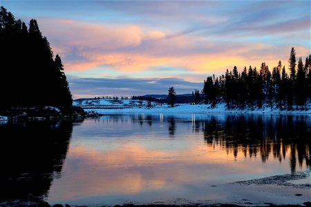 Headlights from cars reflect on the Yellowstone River just north of Hayden Valley photo