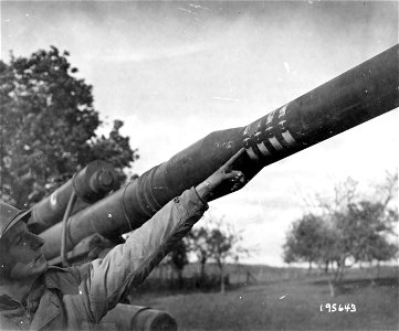 SC 195643 - This close-up of a captured German gun, in Grandvillers, France, shows apparent score of weapon on four American heavy bombers. 17 October, 1944. photo
