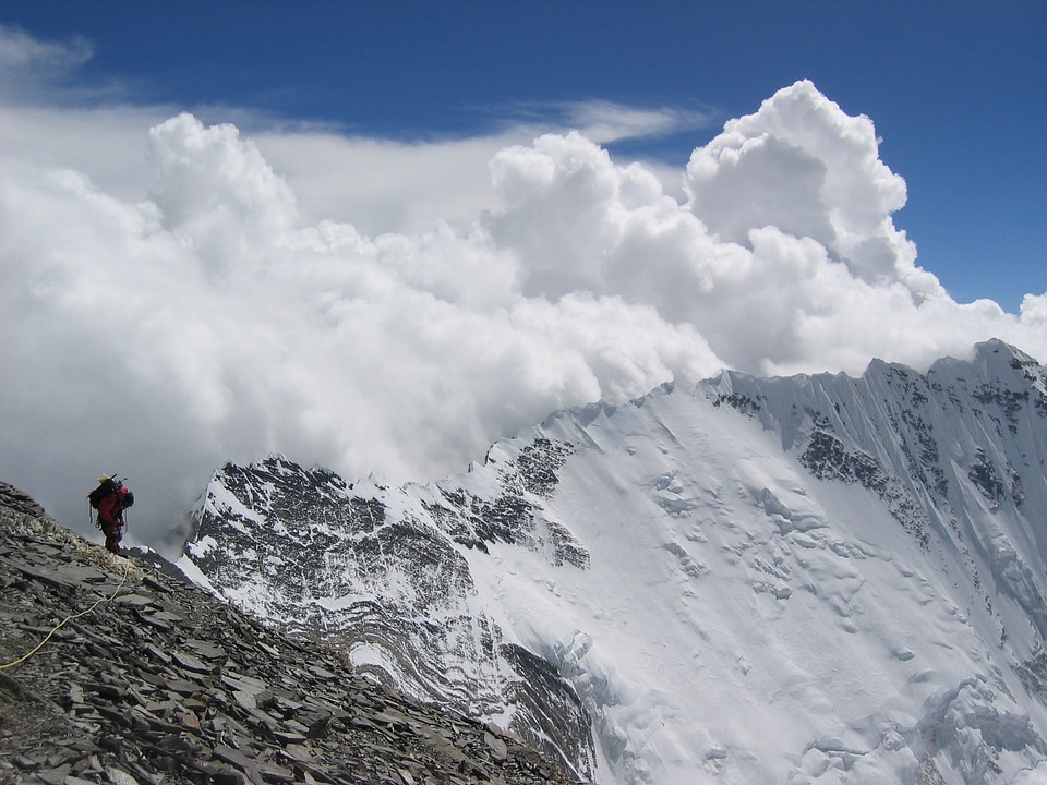 Climber reaches the summit of Everest. Mountain peak Everest