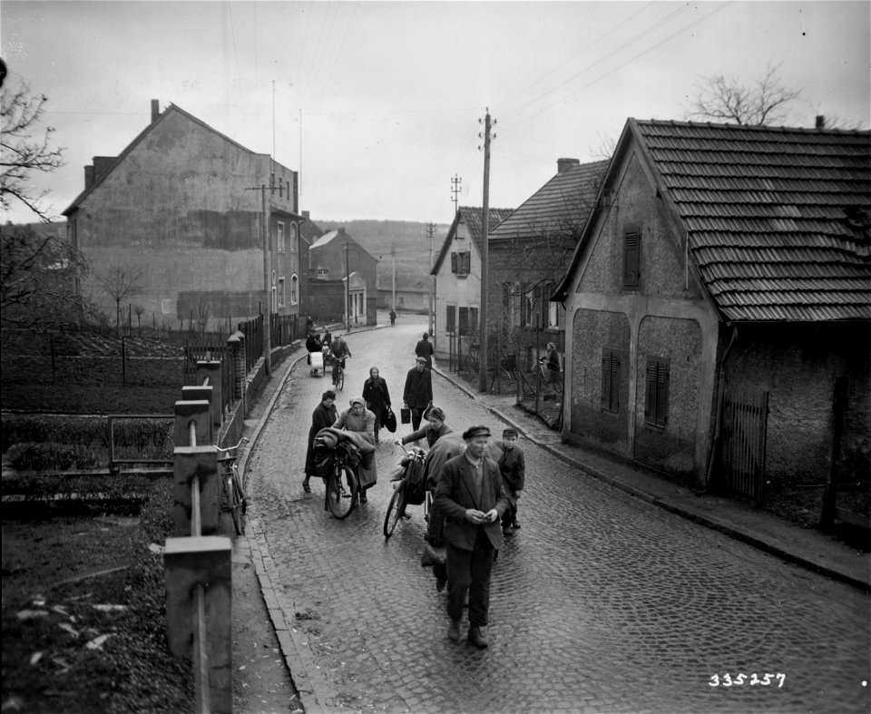 SC 335257 - Civilians of Hurth, Germany, seek new homes after their own had been destroyed during the 8th Infantry Division drive on the Rhine