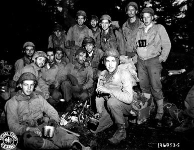 SC 196053-S - Tired frontline infantrymen from a battalion cut off by the Germans for six days in the Belmont sector, France... photo