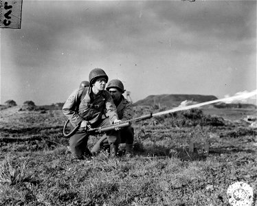 SC 196164 - Sgt. William P. Loveland, left, of Galax, Pa., operates a flamethrower, as M/Sgt. Ashley L. Petit, right, of Charleston S.C., stands by to assist him.