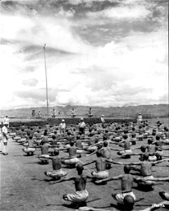 SC 196172 - Left to right (background) Sgt. P.O. Gibson, San Angelo, Texas; Capt. J.R. Rudolph, Birmingham, Ala., and Capt. S.S. Hou, interpreter, give calisthenics to Chinese soldiers at a training station in China.