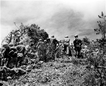 SC 270800 - 2nd Bn., 7th Div. OP on side of many coral rocks approaching Hill 153. 15 June, 1945.
