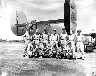 SC 335390 - Piloting the homeward-bound B-24 Liberator of 5th Air Force's 380th Bomb Group, is Col. Forrest L. Brissey, back row, 4th from left, 5035 Trask St., Oakland, Calif.
