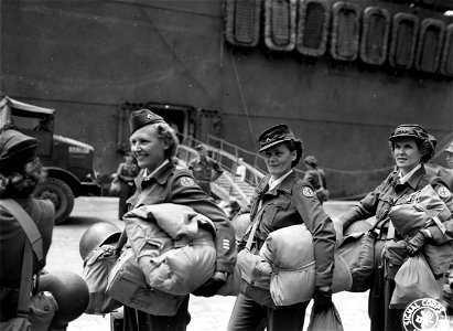 SC 329796 - First American Red Cross workers to leave Europe for duty in the Pacific are these girls shown waiting to board their transport: photo