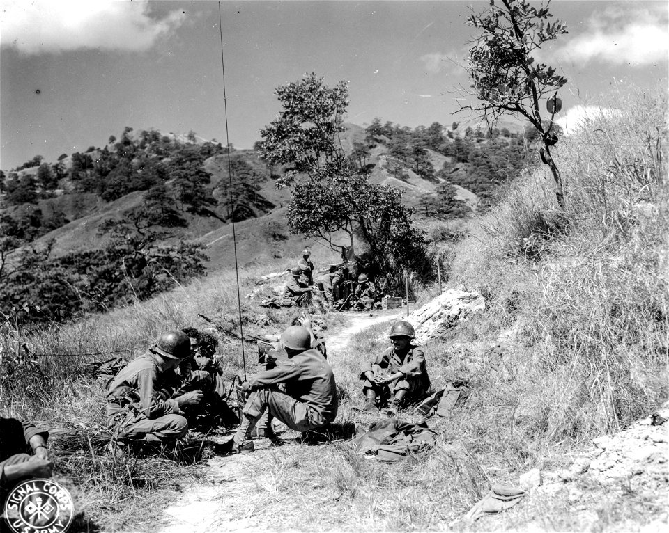 SC 364511 - H Co., 2nd Bn., 127th Inf., 32nd Div. firing 82mm mortar on Jap positions along the Vila Verde Trail. 3 March, 1945.
