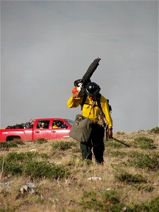 Firefighter with chainsaw photo