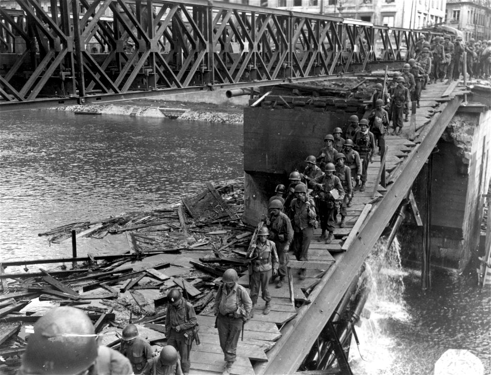 SC 270623 - Men climbing ladders to allow crossing of Doubs River in Besancon. 8 September, 1944.