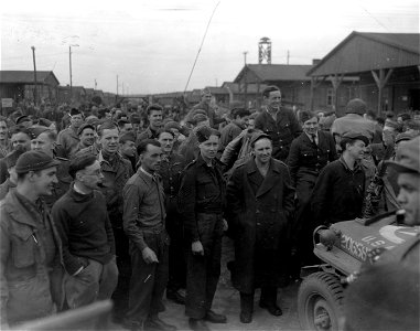 SC 335543 - British and American prisoners held by Nazis in camp near Luckenwalde, greet men of 125th Cavalry Reconnaissance Squadron of 83rd Division. photo